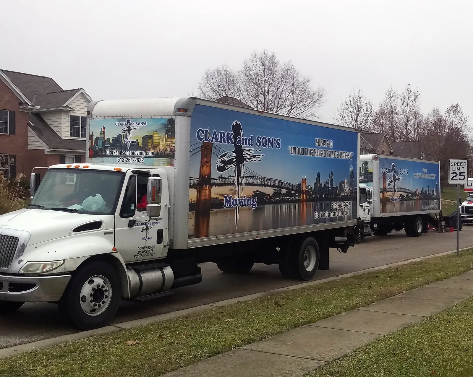 Clark and Sons trucks parked along a residential street